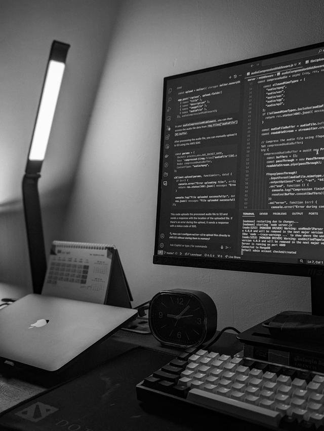 Operator workstation — code on a black and white monitor, Cakglo Ltd builds its own software